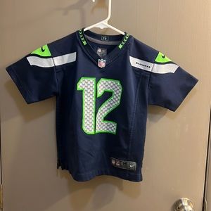 Seahawk official child’s medium jersey.